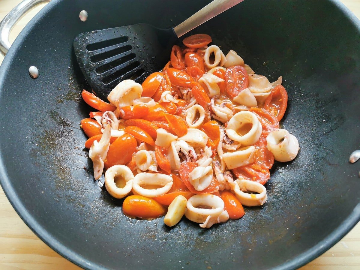 La Calamarata sauce is simmering in a pot.