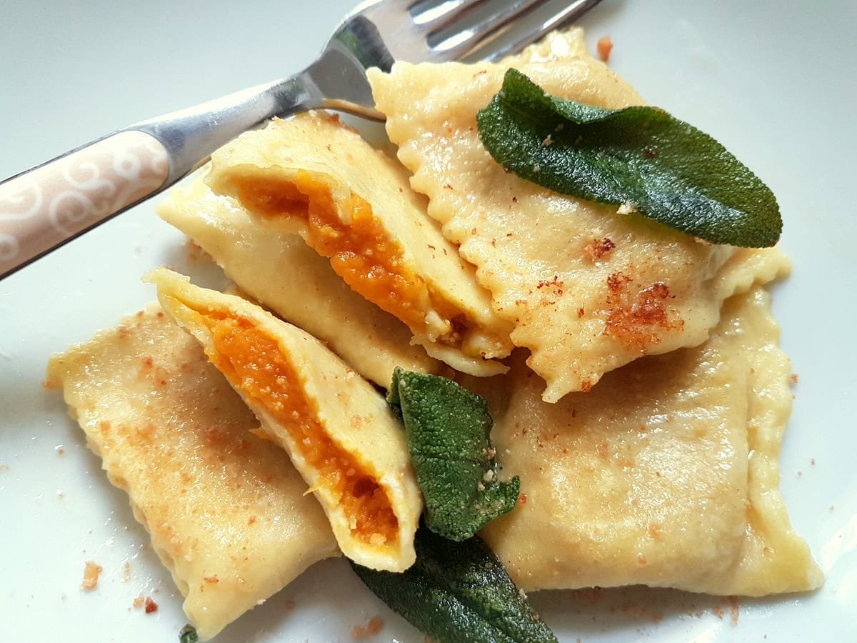 Pumpkin tortelli from Mantova in a white bowl.