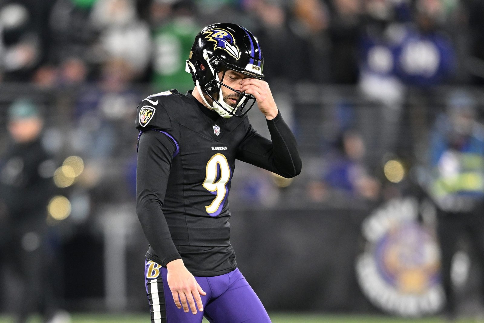 Justin Tucker #9 of the Baltimore Ravens reacts during the third quarter after missing his third kick of the night against the Philadelphia Eagles at M&T Bank Stadium on December 01, 2024 in Baltimore, Maryland.