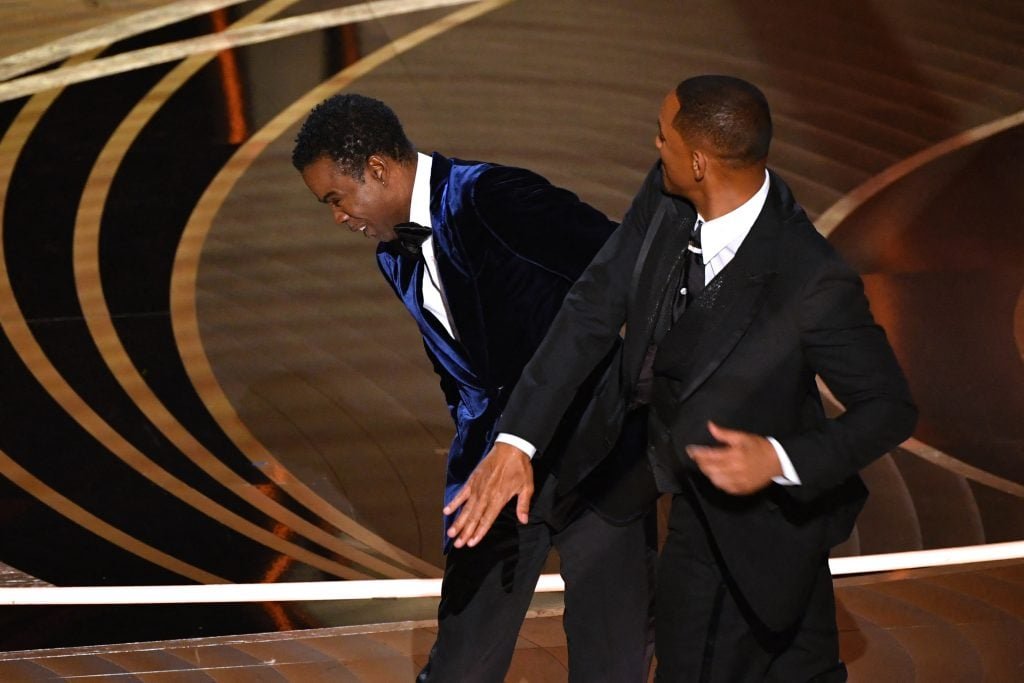 American actor Will Smith punches American actor Chris Rock on stage during the 94th Academy Awards at the Dolby Theater in Hollywood, California on March 27, 2022. 