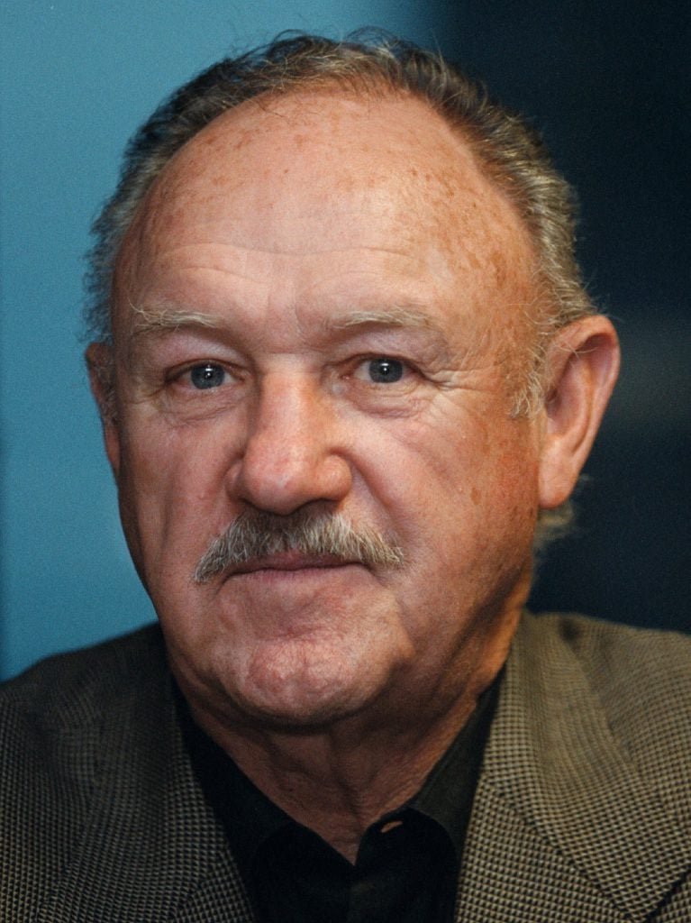 Actor Gene Hackman pauses for a moment while signing copies of his first novel, 