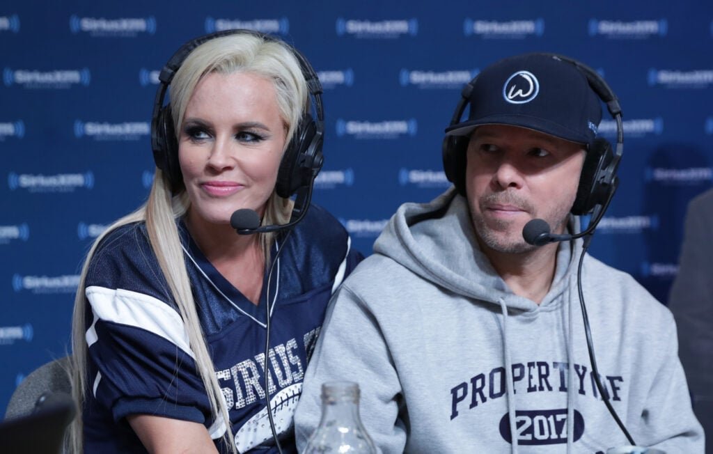 Jenny McCarthy, Left, hosts a special edition of her Siriusxm Show, The Jenny McCarthy Show, Live from the Siriusxm set with Donnie Wahlberg on Super Bowl Li Radio Row at George R. Brown Convention Center on February 3, 2017 in Houston, Texas.