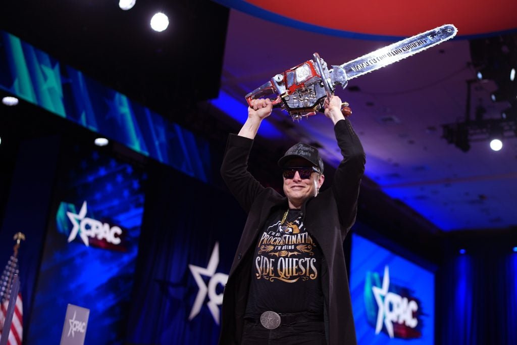 CEO for Tesla and Spacex Elon Musk leaves the stage with a chainsaw after talking at the Conservative Political Action Conference (CPAC) at Gaylord National Resort Hotel and Convention Center on February 20, 2025 in Oxon Hill, Maryland.
