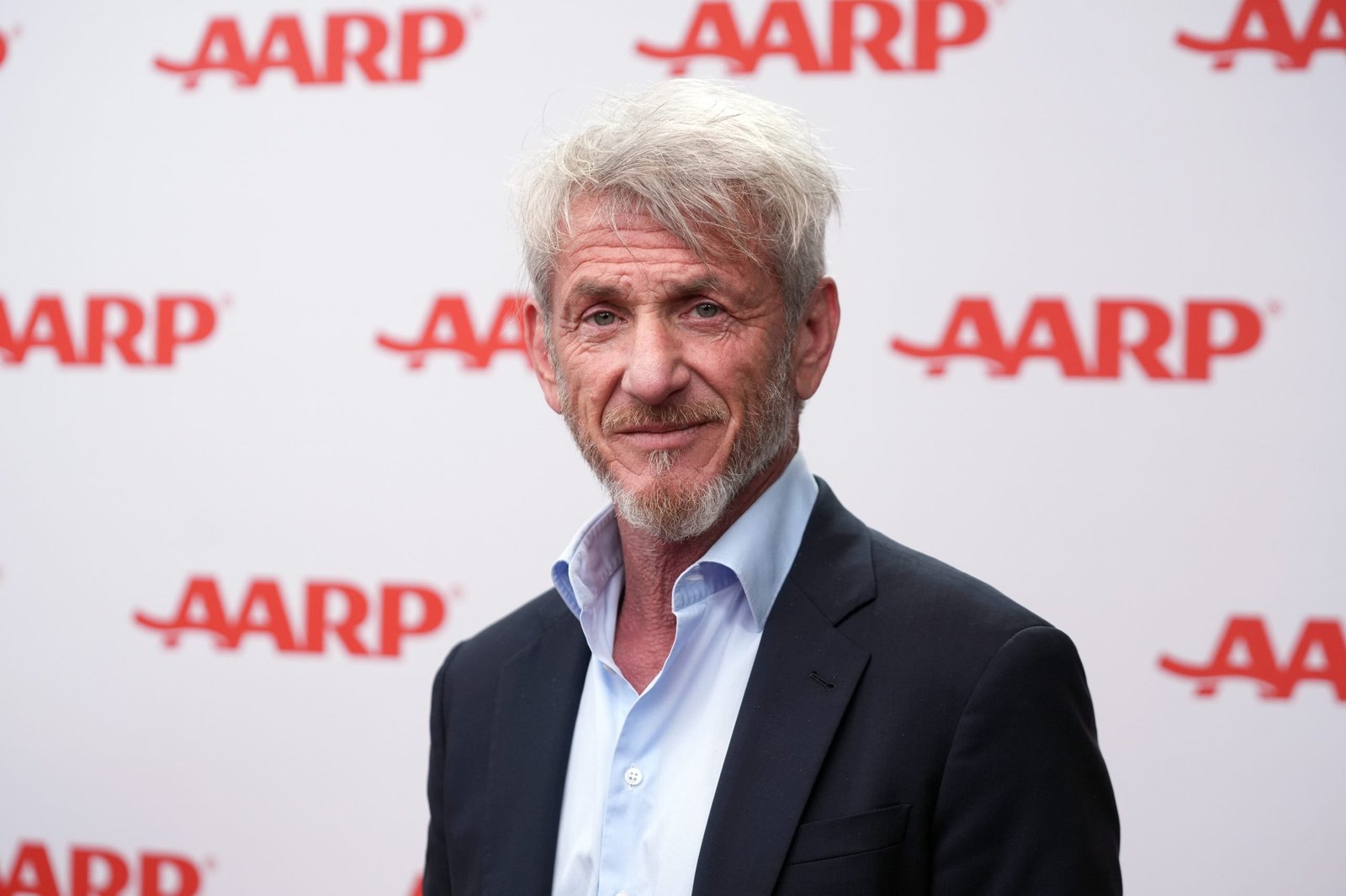 Sean Penn poses in the photo booth during AARP