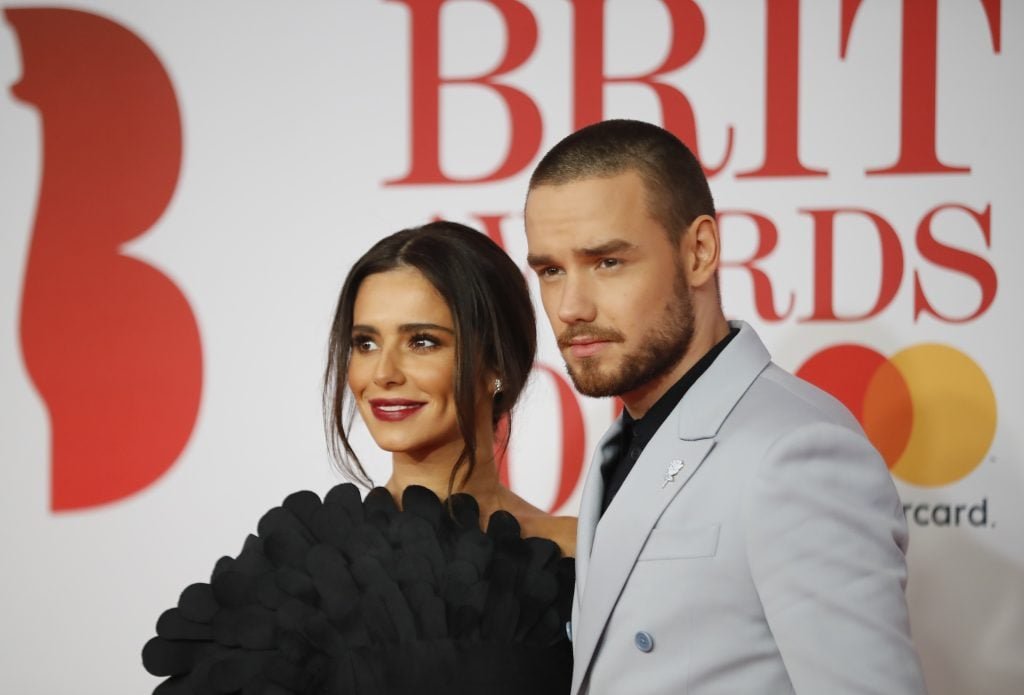 British singer-songwriter Liam Payne and partner Cheryl make up on the red carpet on arrival at the Brit Awards 2018 in London on February 21, 2018.