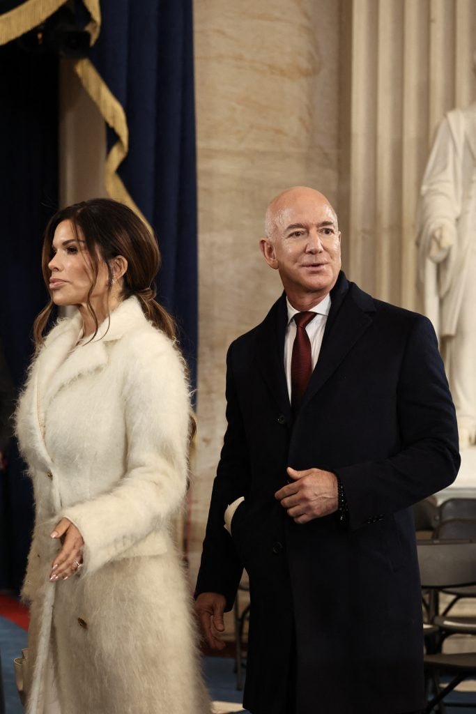 Founder of Amazon and Blue Origin Jeff Bezos and his fiancé Lauren Sanchez resigns inauguration ceremonies in the Rotunda in the US capital on January 20, 2025 in Washington, DC. 