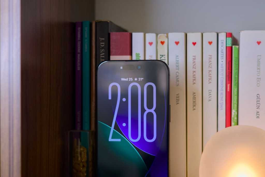 iPhone 16 Pro on a bookshelf